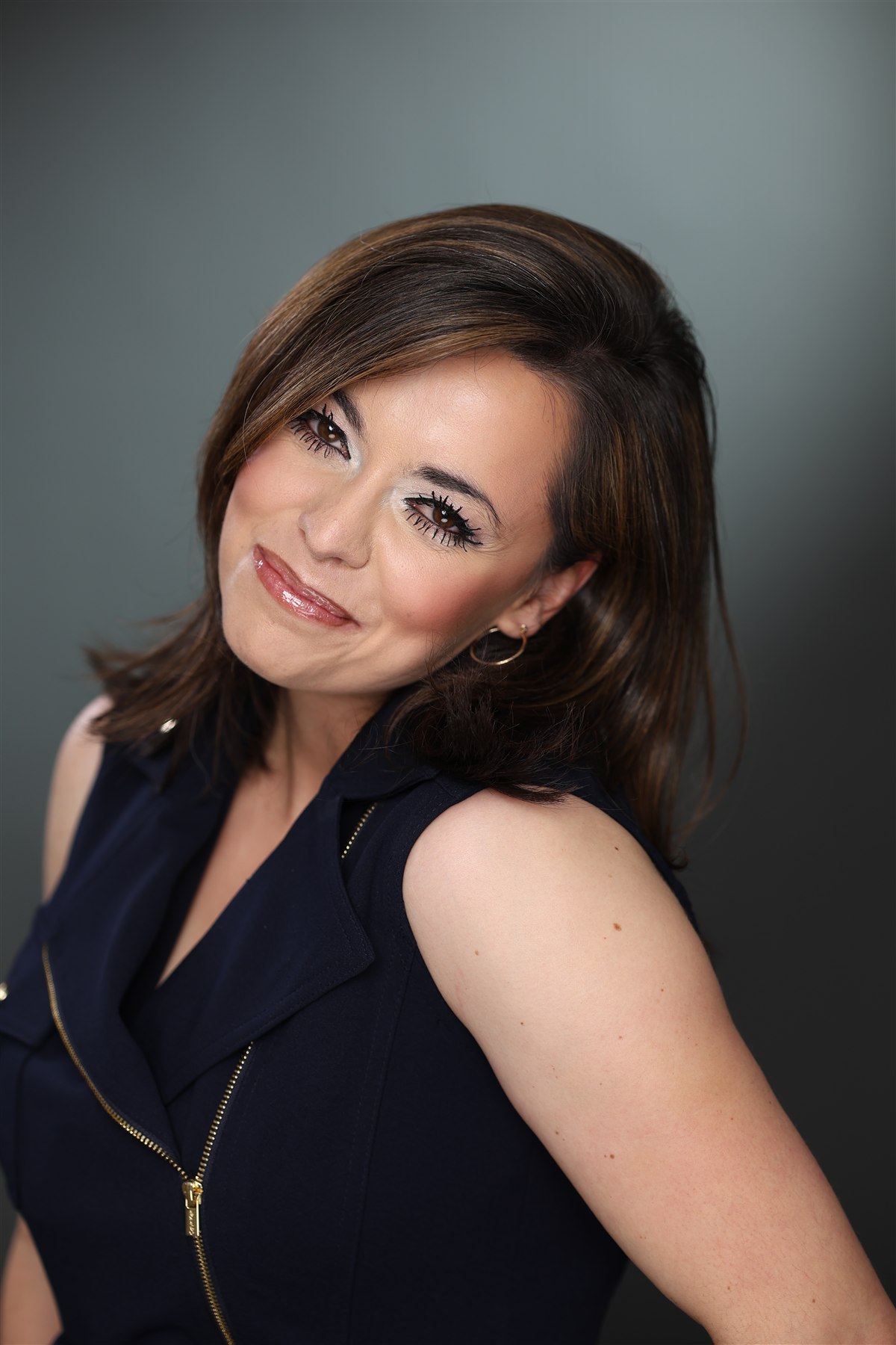 Portrait of Michelle Lush against a dark background
